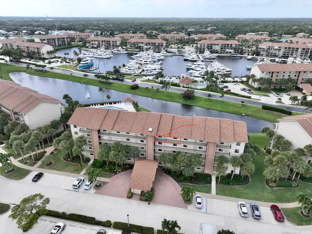 an aerial view of a house with a lake view