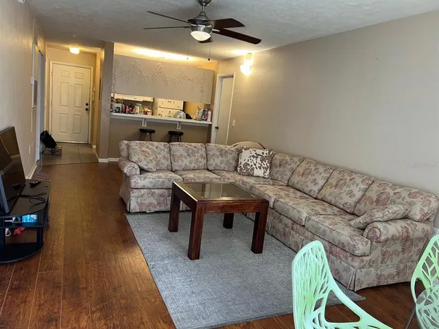 a living room with furniture and a large window