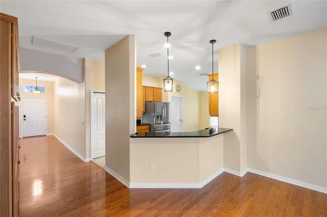 a view of a livingroom with wooden floor