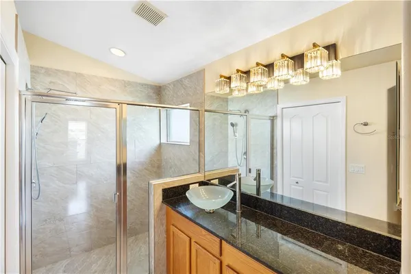 a view of a bathroom with a toilet sink and a mirror