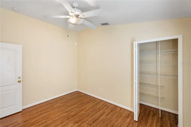 a bathroom with a granite countertop sink toilet a mirror and shower