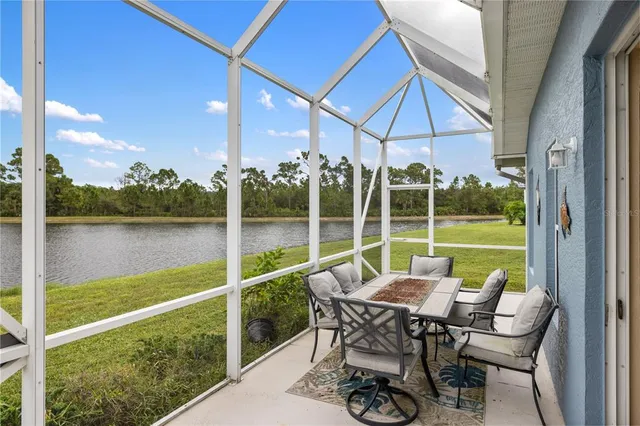 a view of a lake with houses in the back