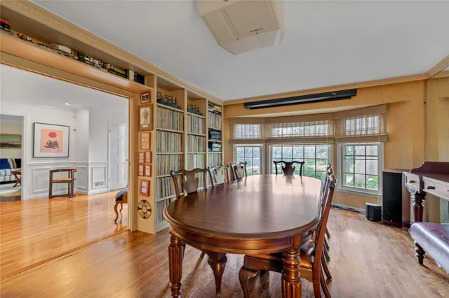 a dining room with furniture and wooden floor