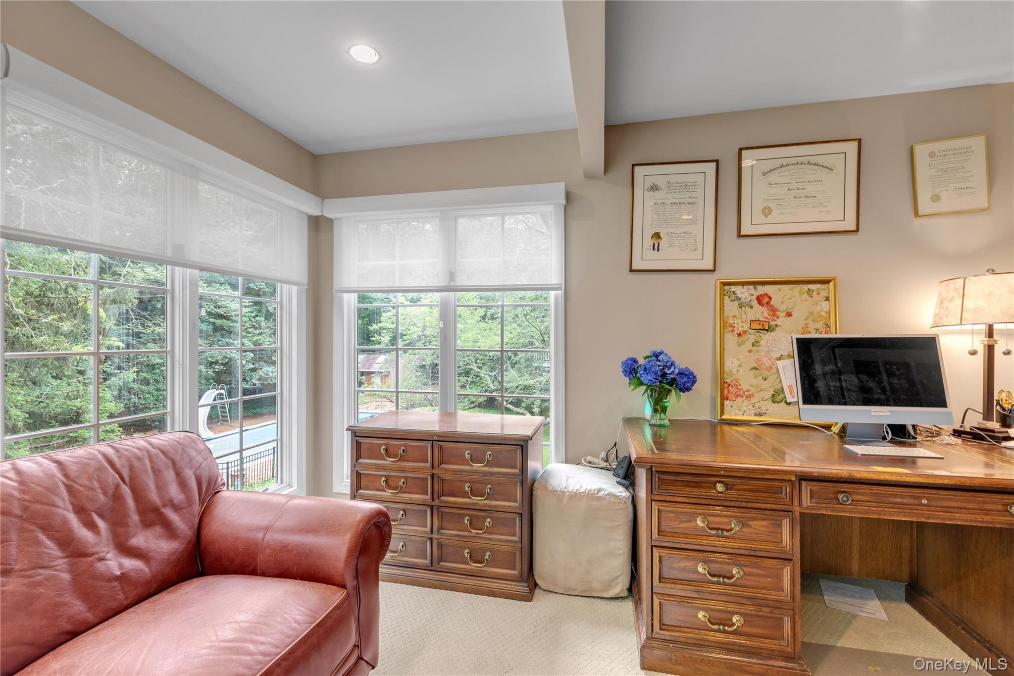 26 Rolling Drive Glen Head, NY 11545 - Photo 22 of 31 a living room with furniture flat screen tv and a large window