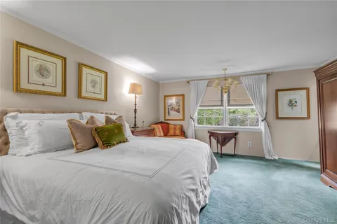 a bed room with a bed and a desk