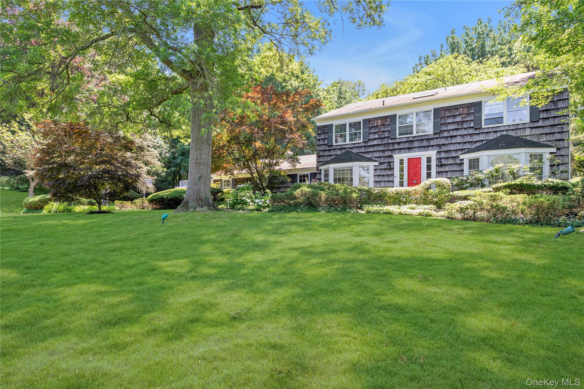 26 Rolling Drive Glen Head, NY 11545 - Photo 28 of 31 a view of a house with a big yard plants and large trees