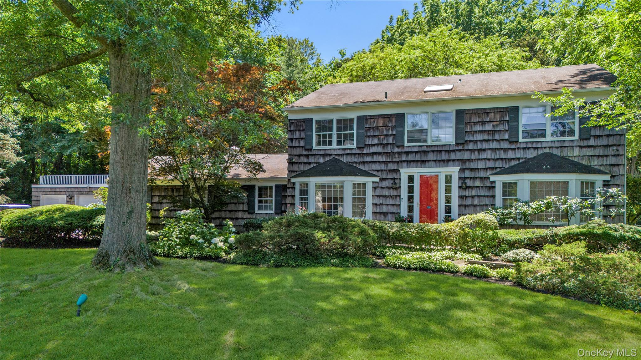 26 Rolling Drive Glen Head, NY 11545 - Photo 4 of 31 a front view of house with yard and green space