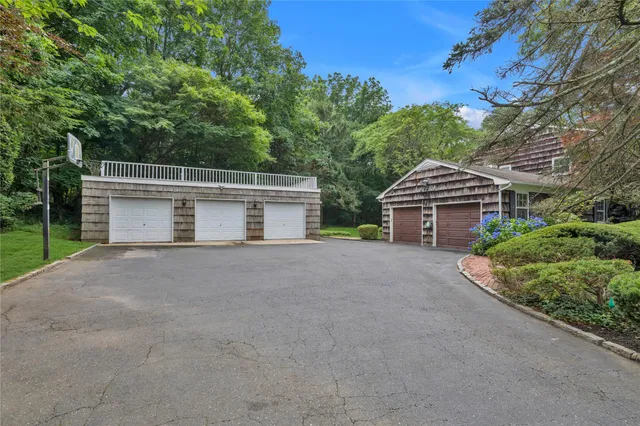 a view of a house with a yard and garage