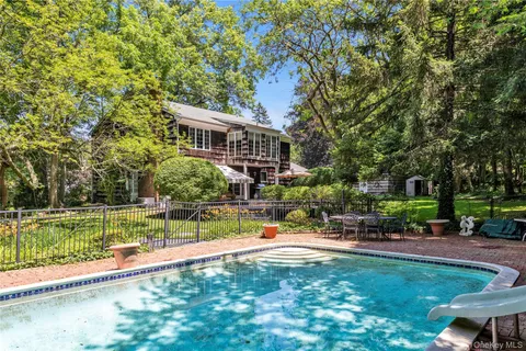 a view of a house with a yard porch and sitting area