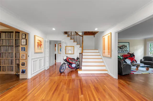a view of a livingroom with hardwood and furniture