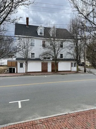 a view of multiple houses with a street