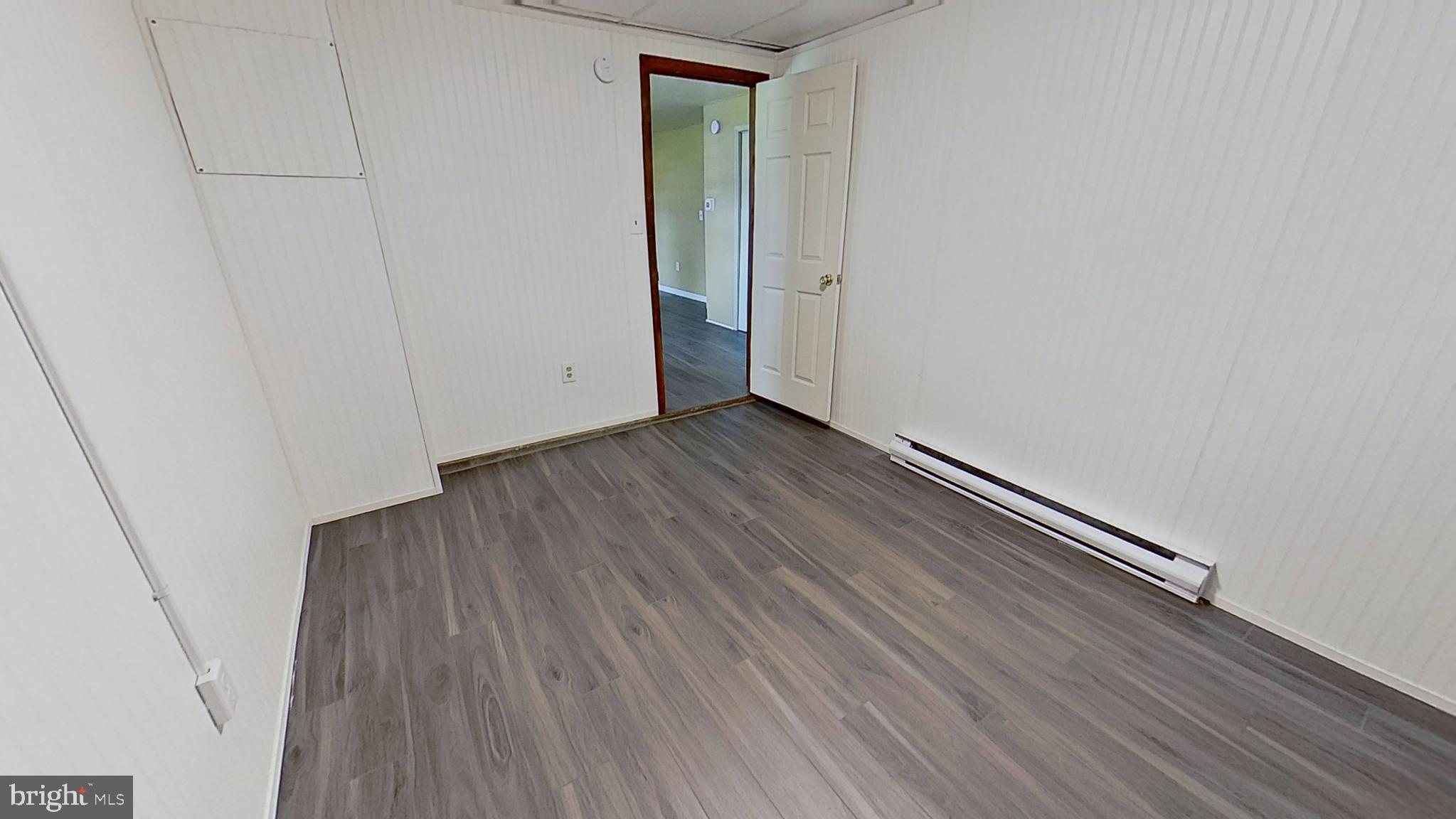 648 Broadway, Unit E Hanover, PA 17331 - Photo 7 of 12 a view of a room with wooden floor