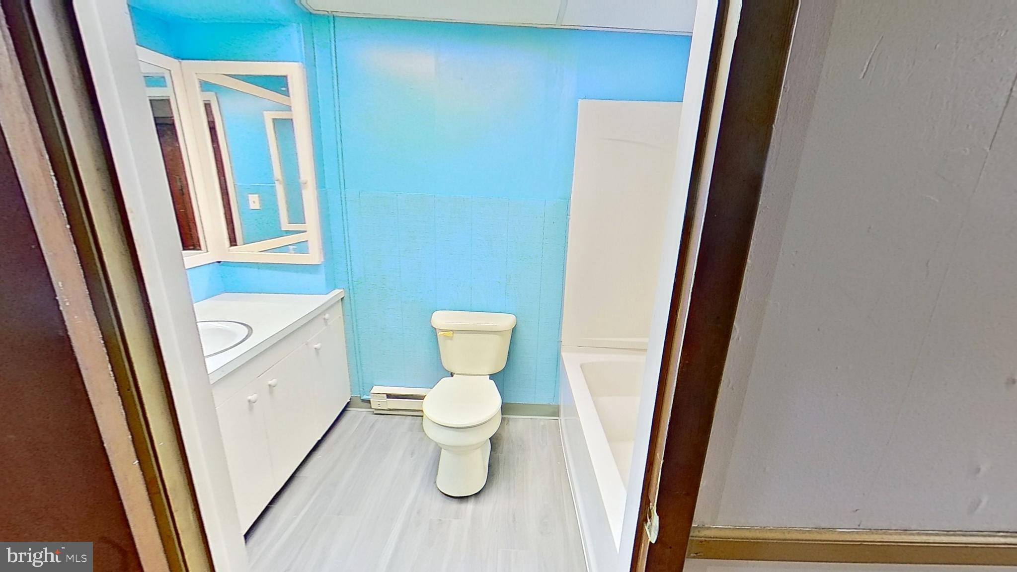 648 Broadway, Unit E Hanover, PA 17331 - Photo 8 of 12 a bathroom with a sink and a toilet