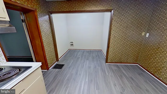 a view of front door with wooden floor