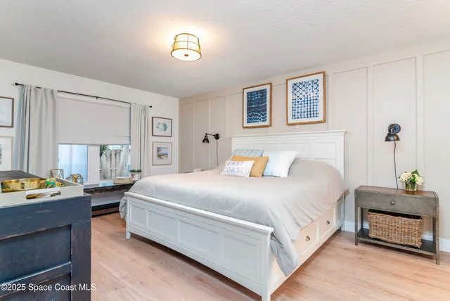 a bedroom with a bed and a table