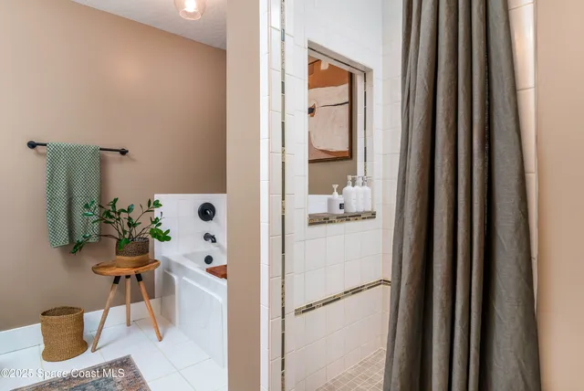 a room with a table and a potted plant