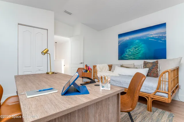 a potted plant sitting in front of a house