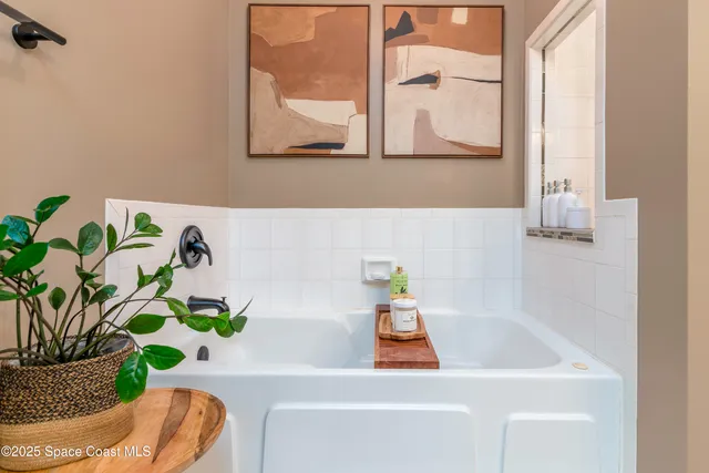 an aerial view of a houses with a yard