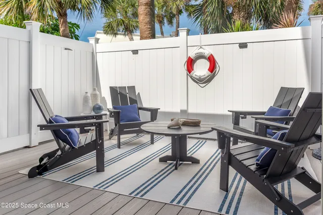 a view of a house with a flower garden