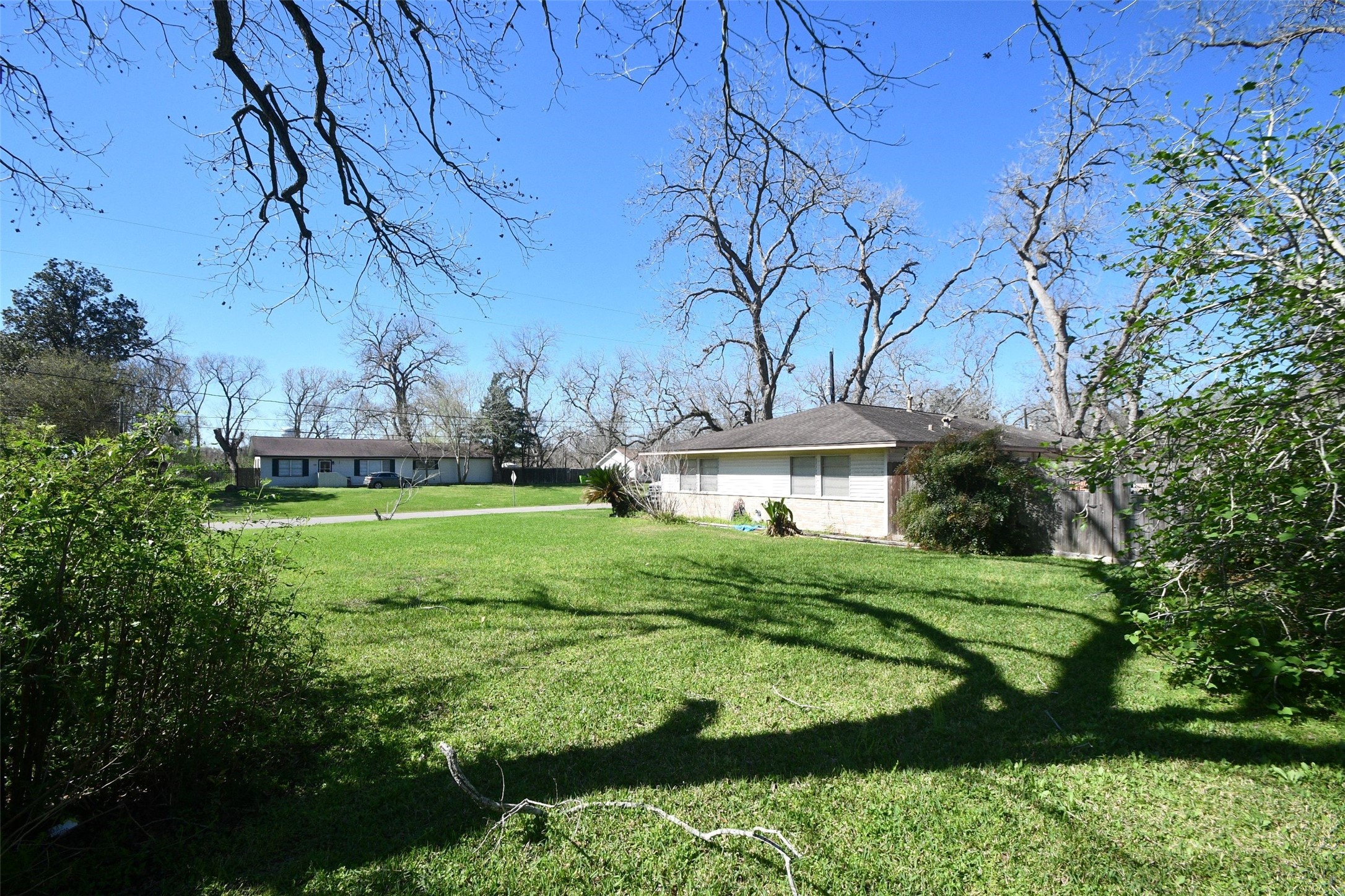 607 Riveredge Drive Richmond, TX 77406 - Photo 6 of 19 a view of a house with a big yard and potted plants