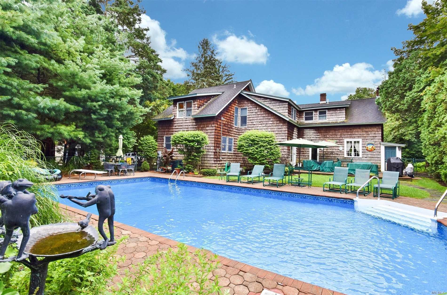 343 Greenlawn Road Greenlawn, NY 11740 - Photo 1 of 1 a view of a house with pool and chairs