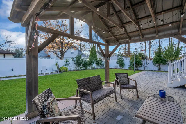 a view of a patio with a yard