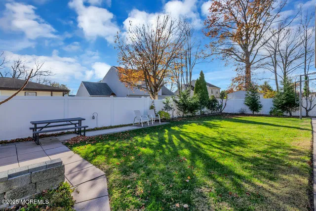 a view of yard with patio