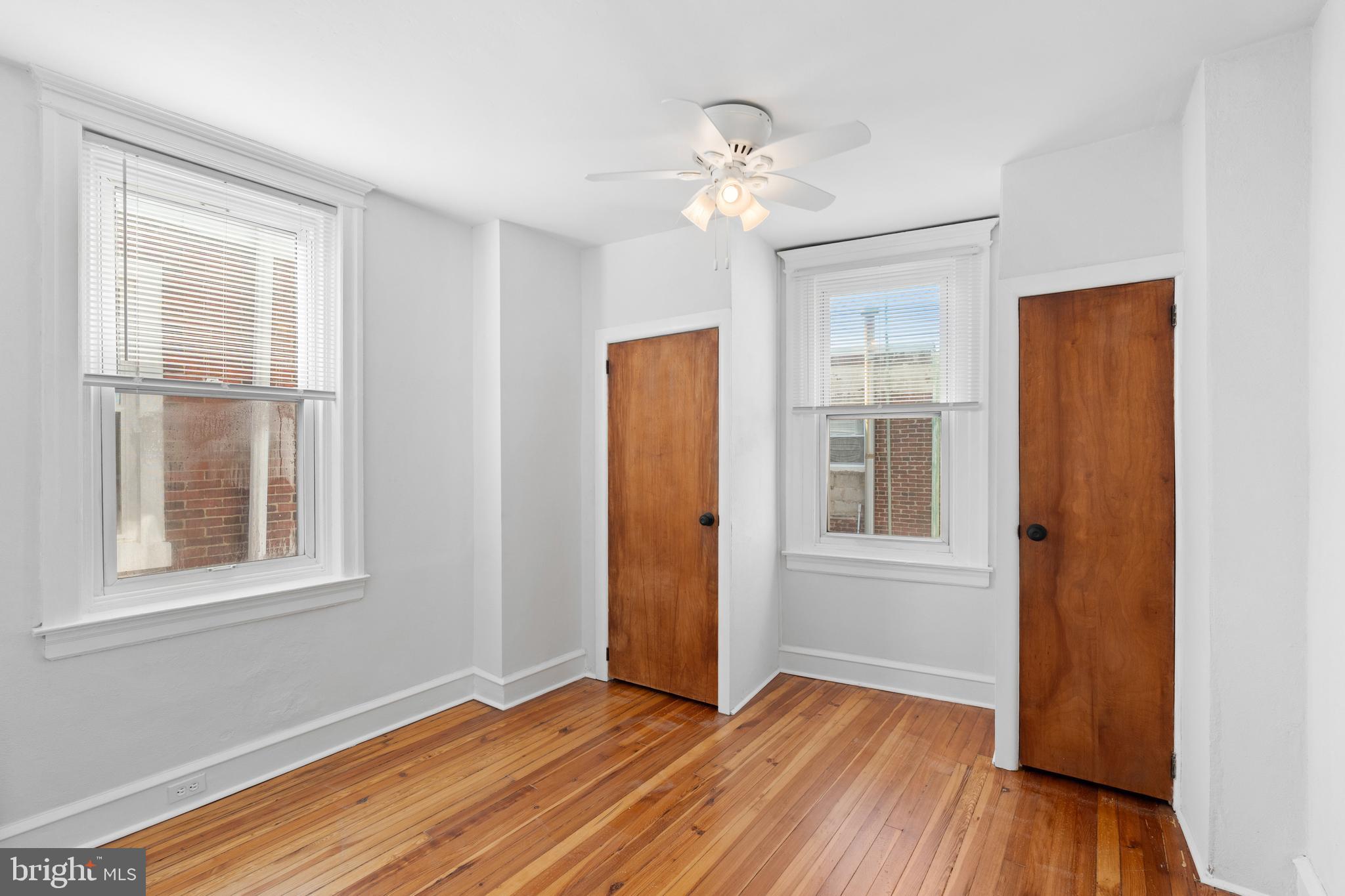 244 Mifflin Street Philadelphia, PA 19148 - Photo 13 of 21 a view of an empty room with wooden floor and a window