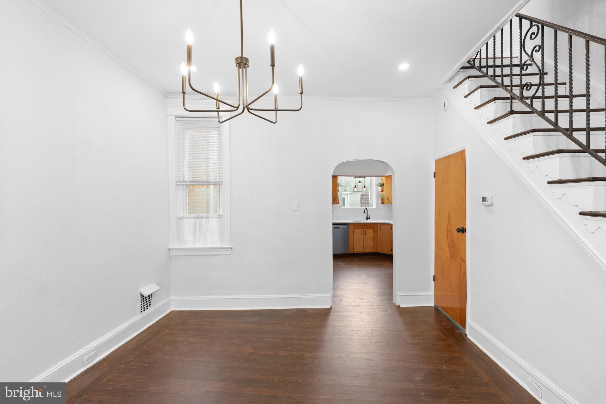 244 Mifflin Street Philadelphia, PA 19148 - Photo 5 of 21 a view of a livingroom with wooden floor and a ceiling fan
