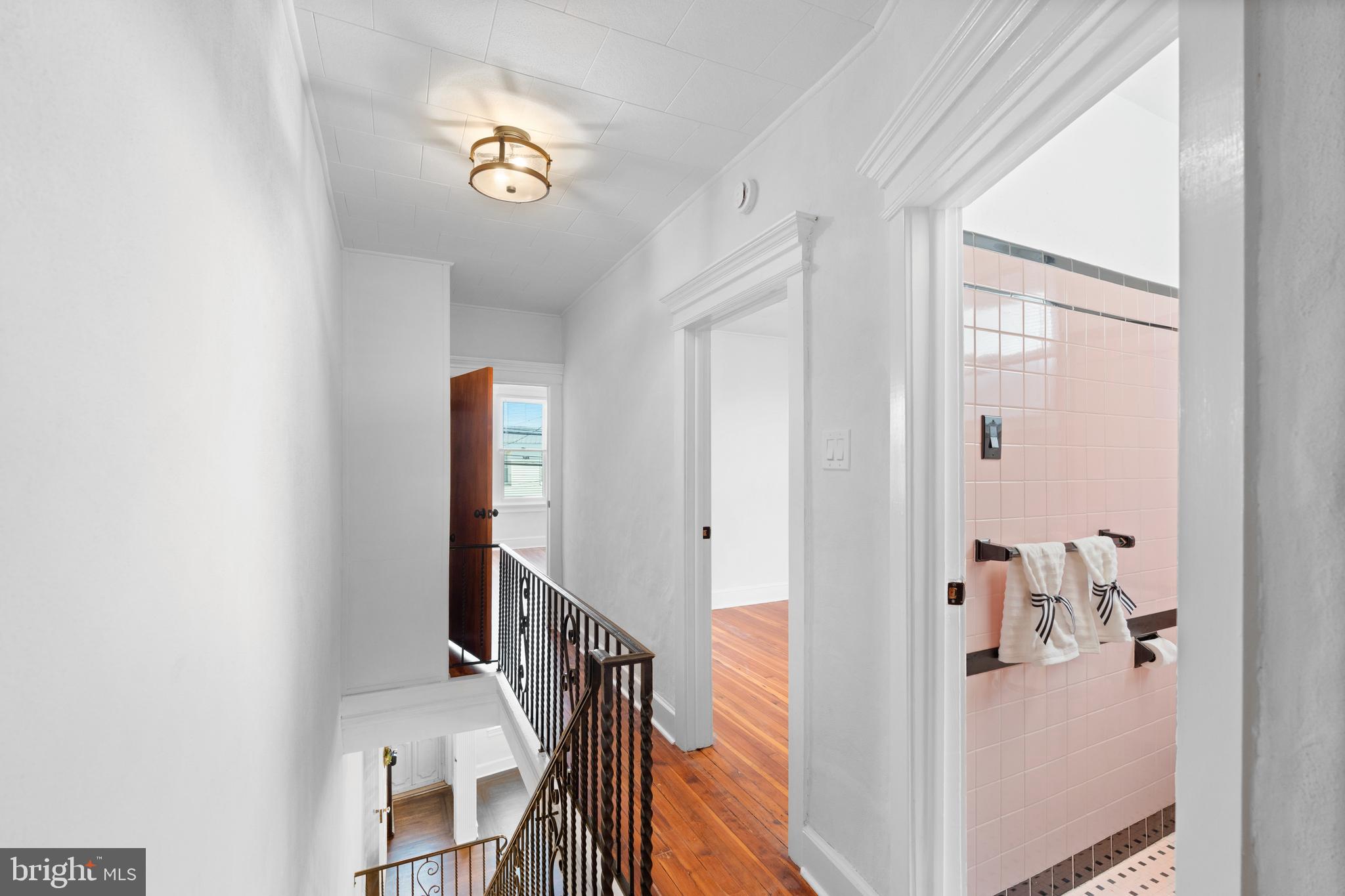 244 Mifflin Street Philadelphia, PA 19148 - Photo 8 of 21 a view of a hallway with entryway wooden floor and front door