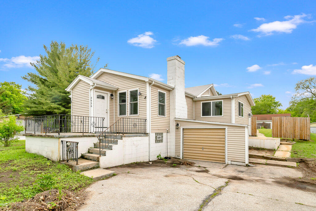 3936 Ross Road Gary, IN 46408 - Photo 14 of 18 a front view of a house with a yard