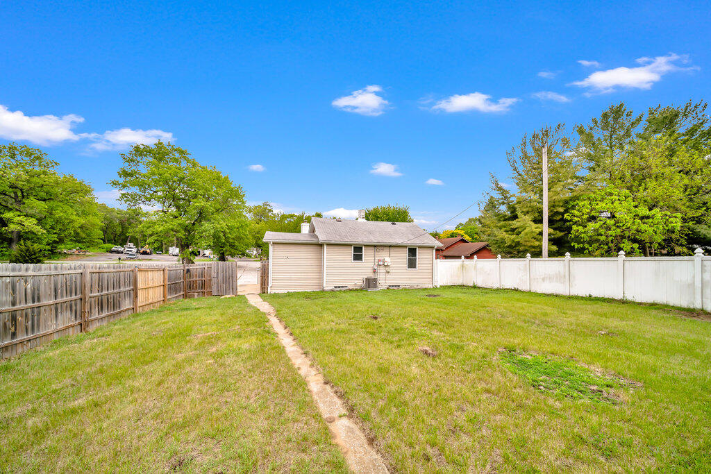 3936 Ross Road Gary, IN 46408 - Photo 18 of 18 a view of an house with swimming pool and a yard