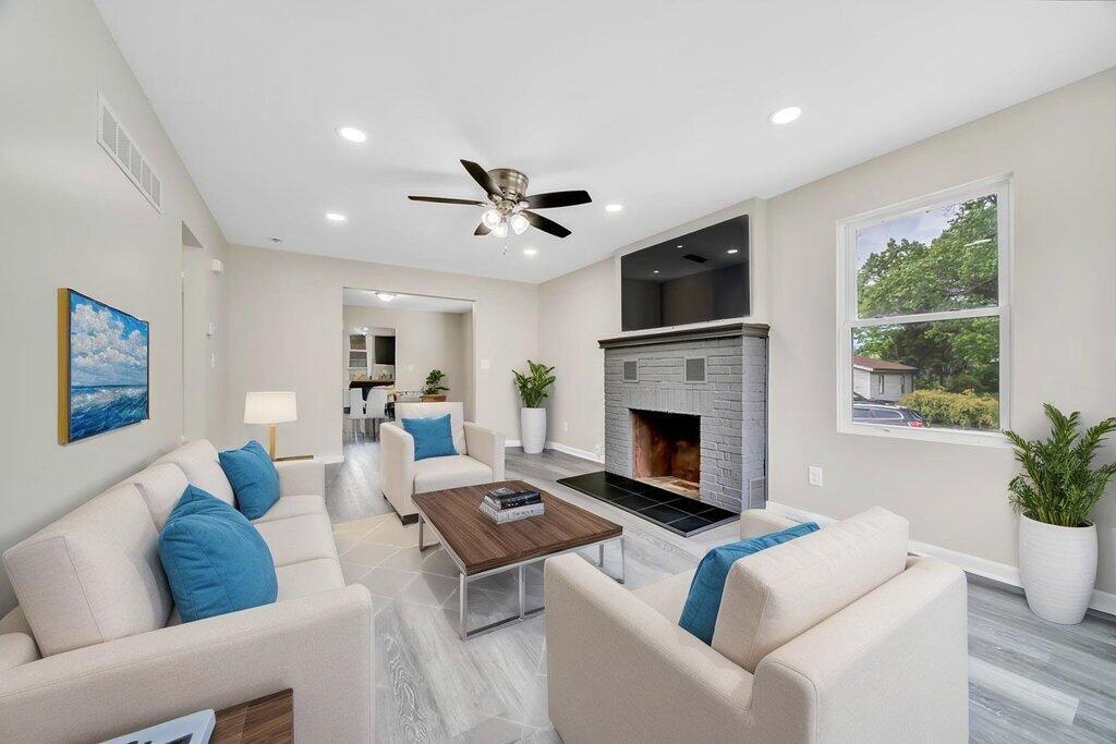 3936 Ross Road Gary, IN 46408 - Photo 2 of 18 a living room with furniture a fireplace and a flat screen tv