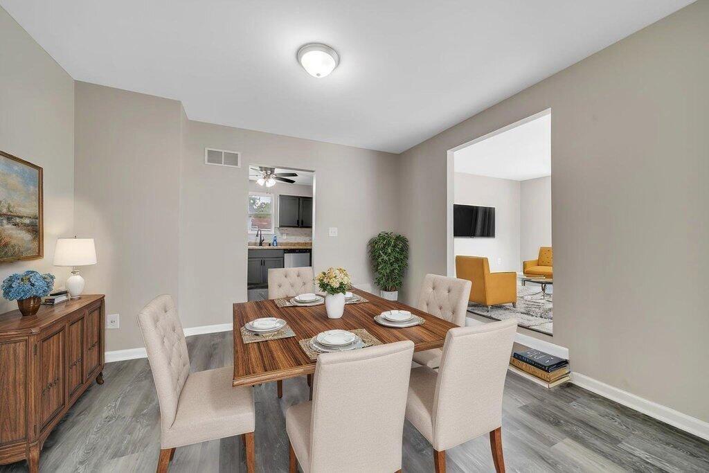 3936 Ross Road Gary, IN 46408 - Photo 4 of 18 a view of a dining room with furniture and wooden floor