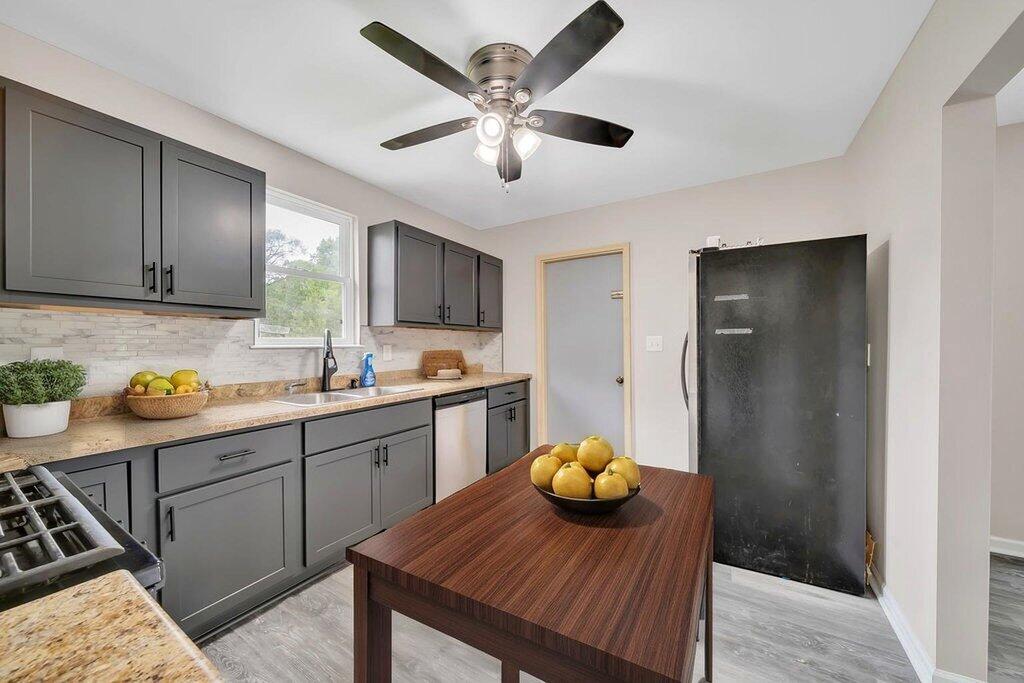 3936 Ross Road Gary, IN 46408 - Photo 6 of 18 a kitchen with a table chairs and appliances