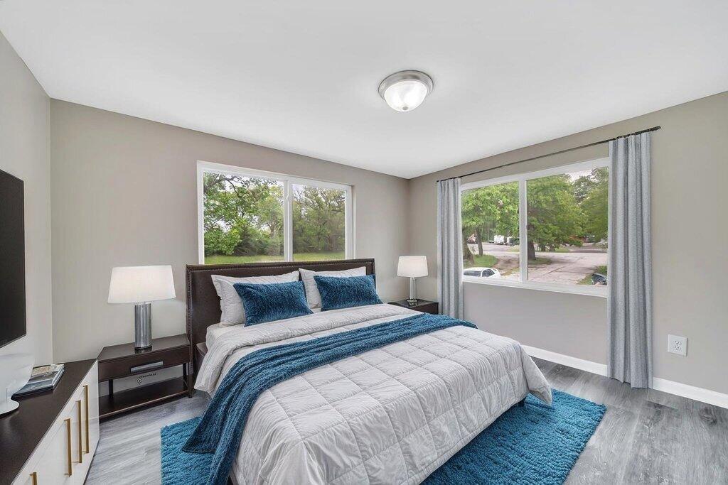 3936 Ross Road Gary, IN 46408 - Photo 8 of 18 a bedroom with a bed and a large window