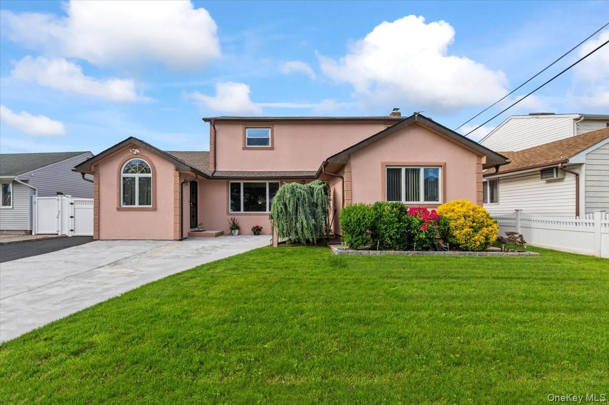 Colonial-style house featuring stucco siding