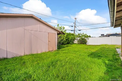 a view of a house with backyard porch and sitting area