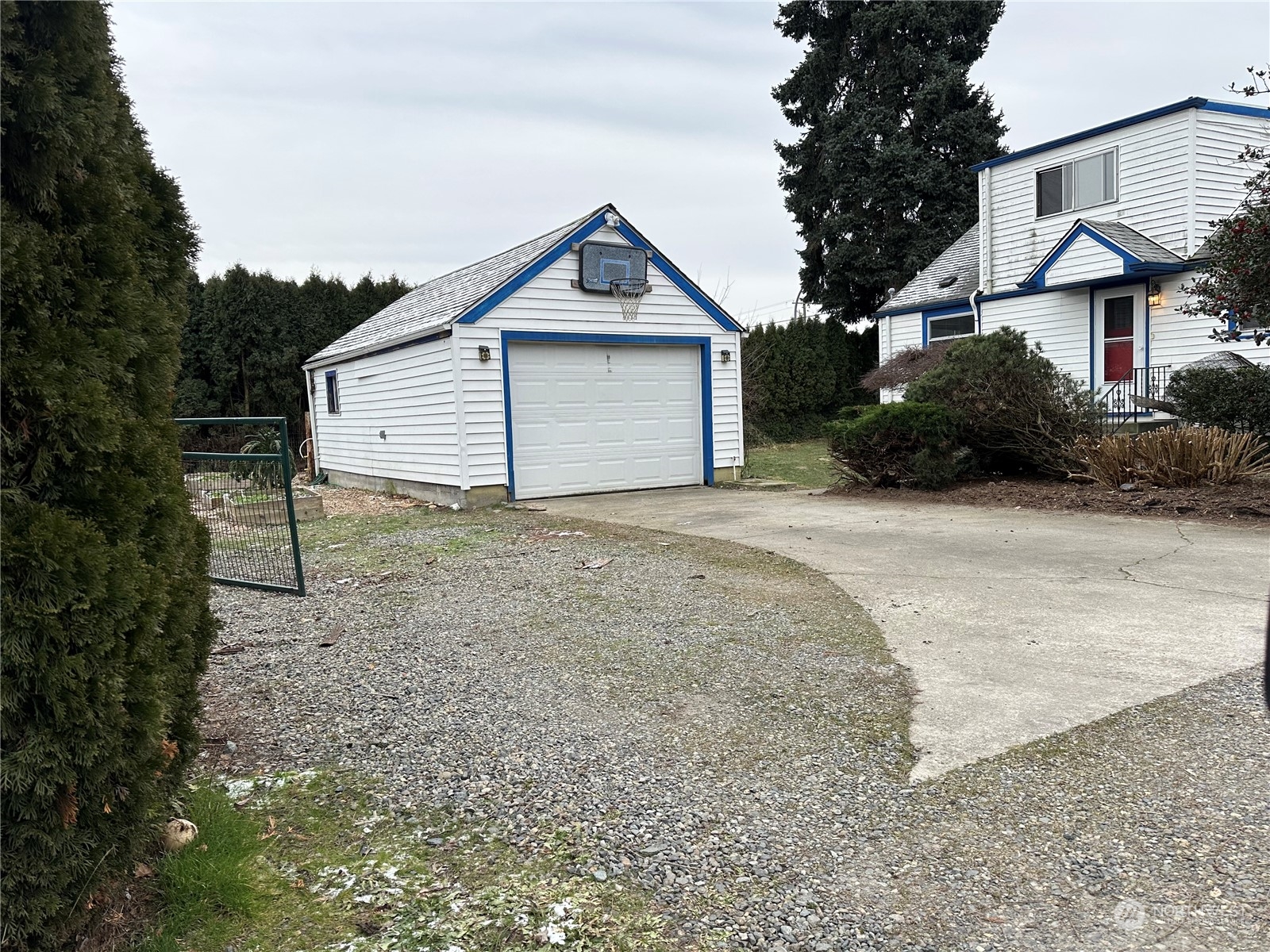 715 Thompson Street Sumner, WA 98390 - Photo 2 of 6 a view of a house with a yard and large tree