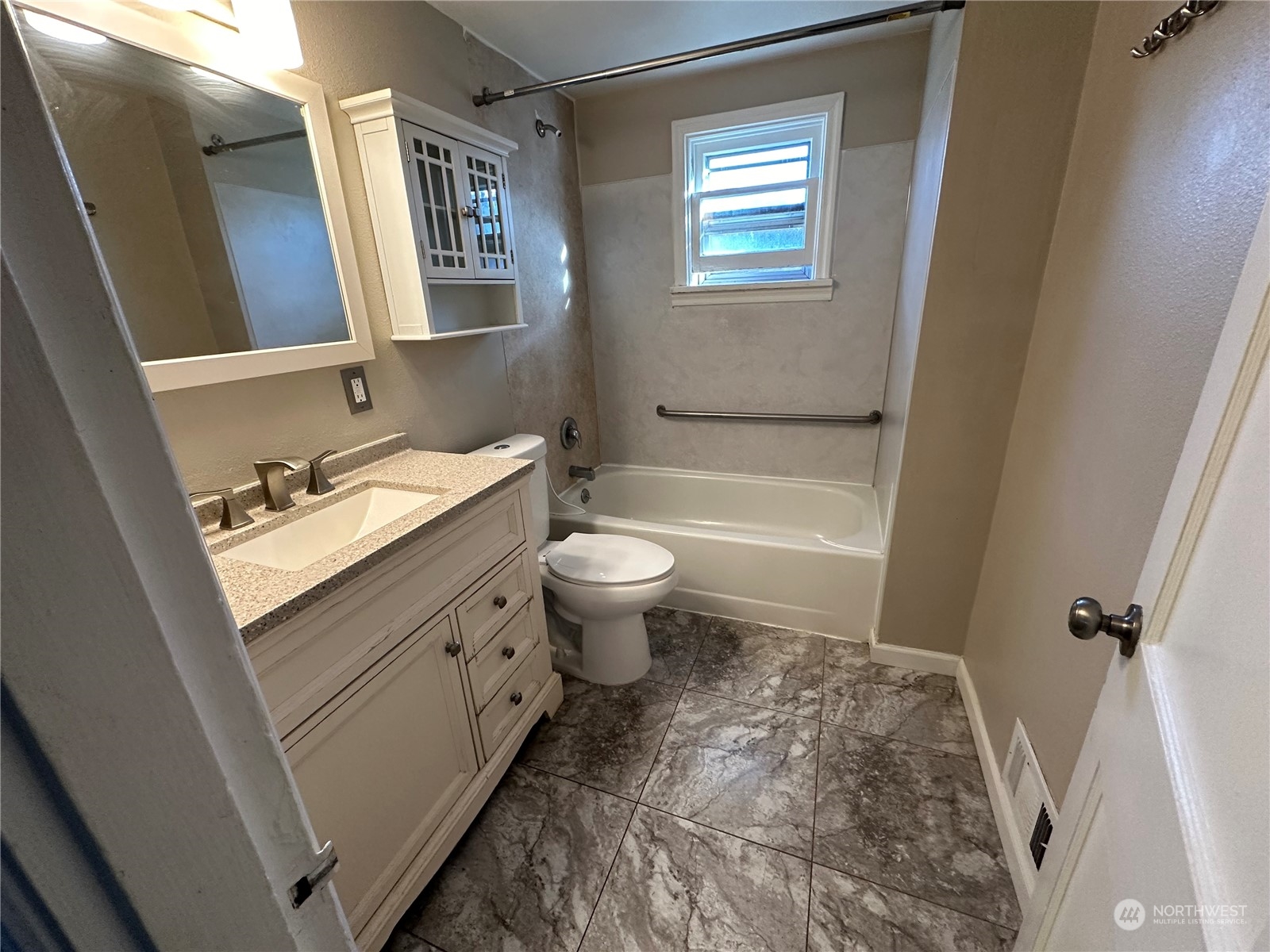 715 Thompson Street Sumner, WA 98390 - Photo 6 of 6 a bathroom with a sink a toilet and a mirror