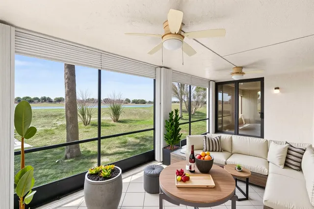 a living room with large windows