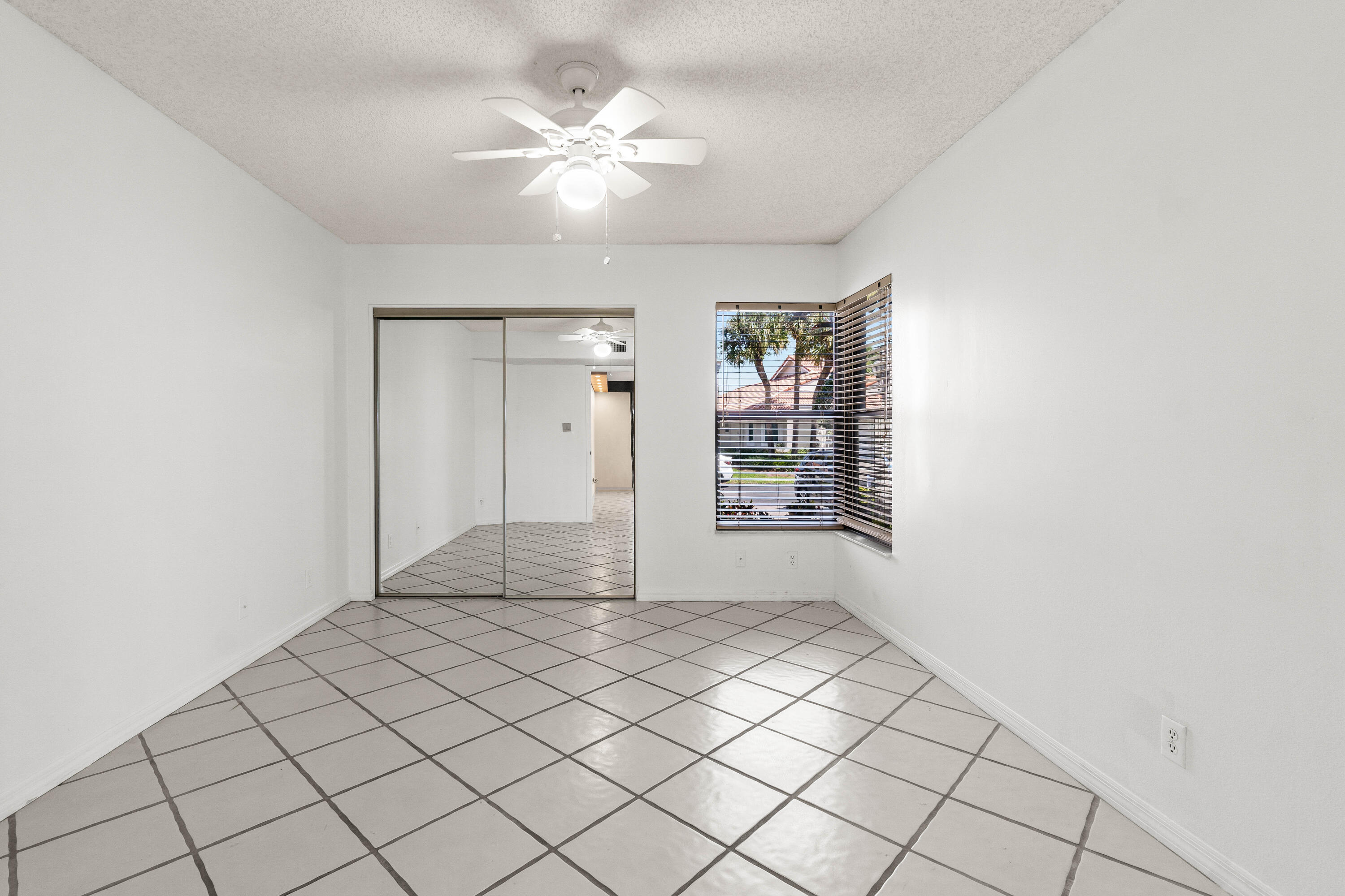 10920 Lakemore Lane, Unit 101 Boca Raton, FL 33498 - Photo 31 of 41 a view of an empty room and window