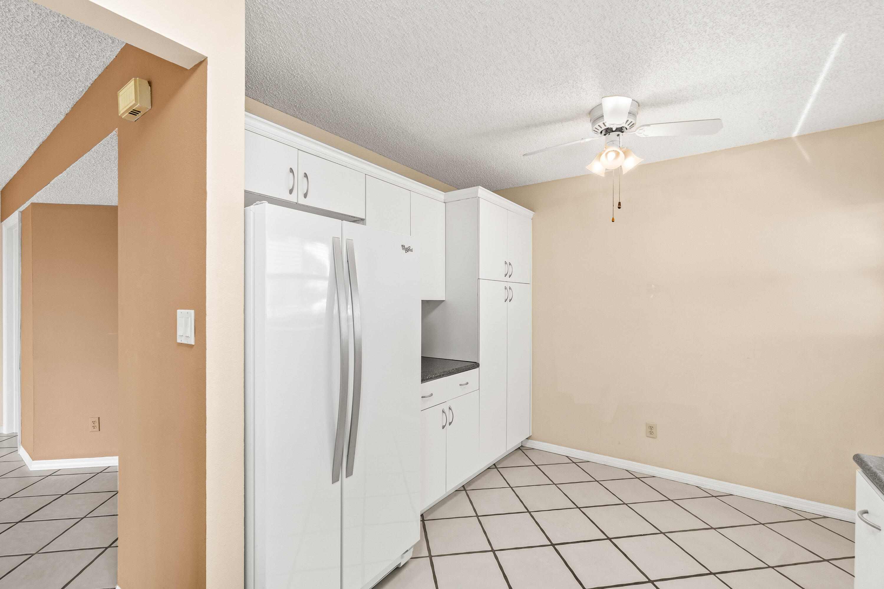 10920 Lakemore Lane, Unit 101 Boca Raton, FL 33498 - Photo 8 of 41 a view of a hallway with a bathroom