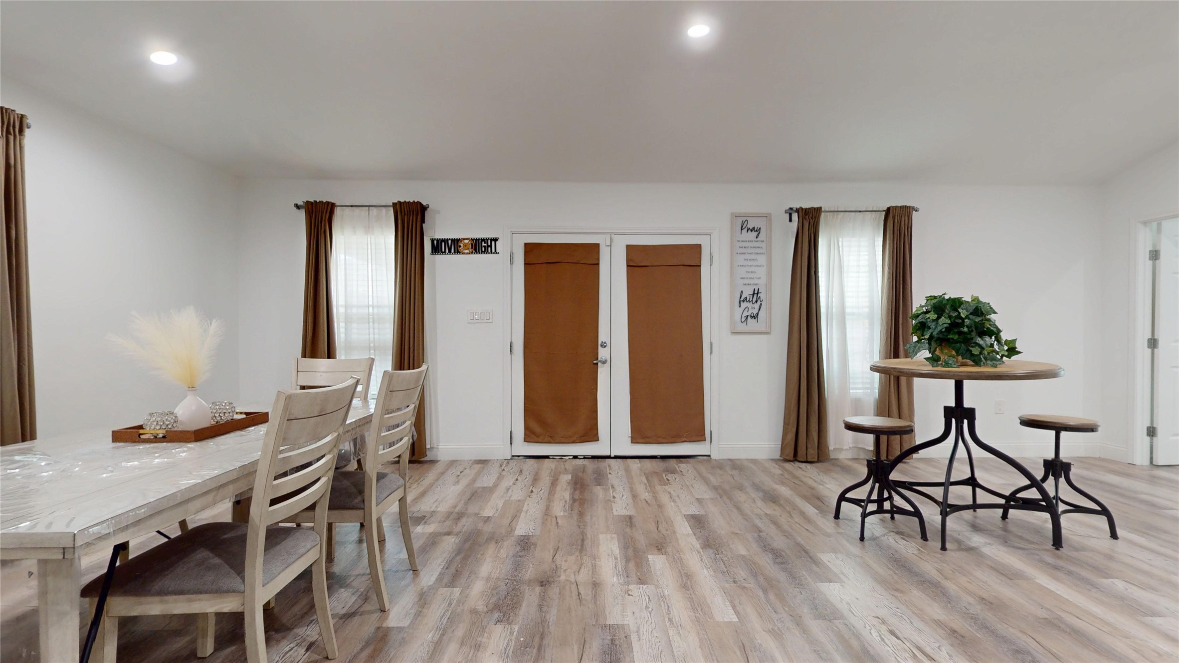 827 Dondell Street Channelview, TX 77530 - Photo 20 of 49 827 Dondell St, Large room with lots of windows for lighting, including french doors opening onto the backyard.