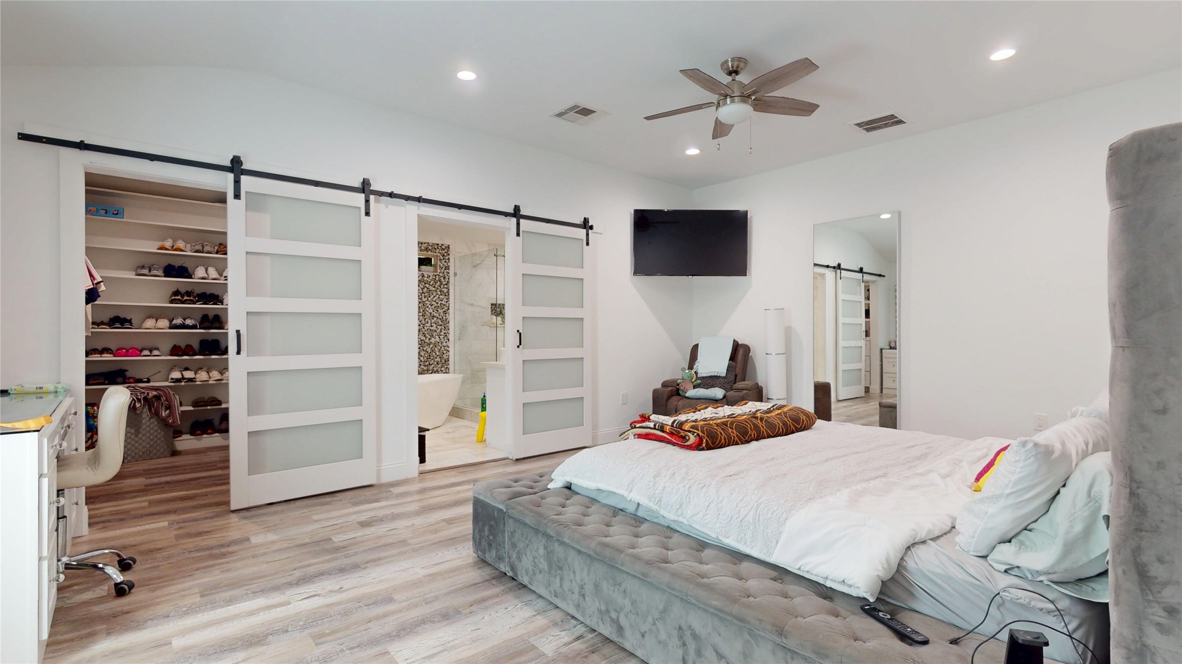 827 Dondell Street Channelview, TX 77530 - Photo 23 of 49 827 Dondell St, Primary bedroom, walk-in closet and primary bathroom with sliding modern doors.