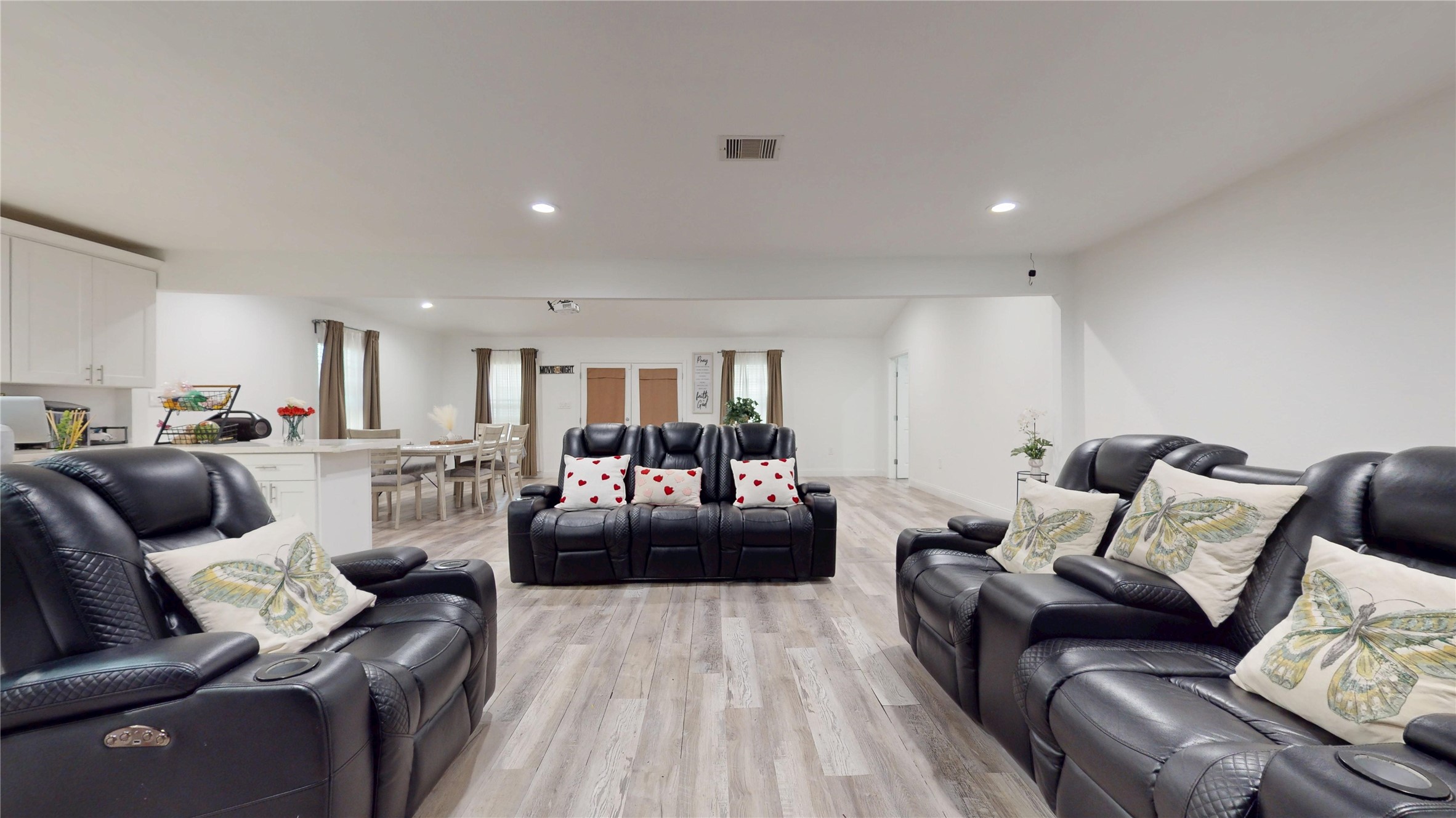 827 Dondell Street Channelview, TX 77530 - Photo 5 of 49 827 Dondell St, Living room with gray wooden laminate floors.