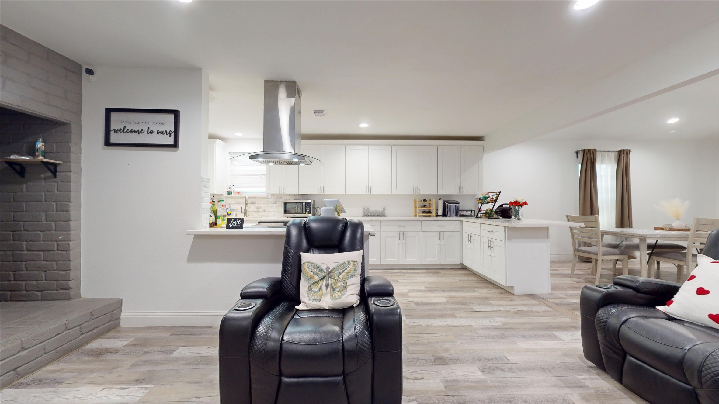 827 Dondell Street Channelview, TX 77530 - Photo 6 of 49 827 Dondell St, Side picture of the living room area and kitchen behind it.