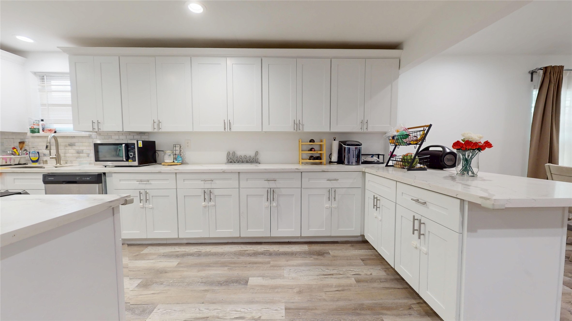 827 Dondell Street Channelview, TX 77530 - Photo 9 of 49 827 Dondell St, White cabinets in kitchen with quartz countertops.