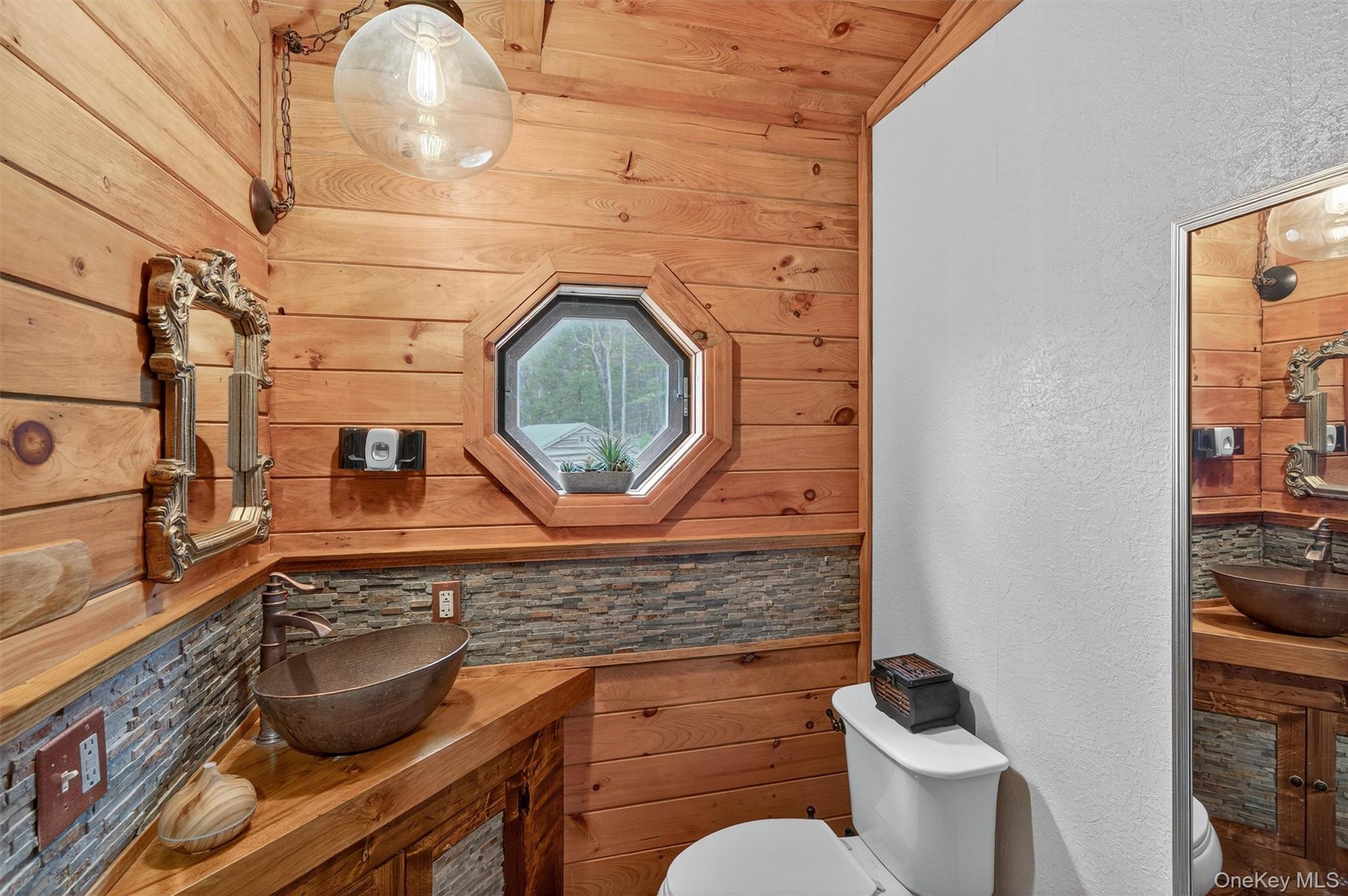 129 Hallock Road Barryville, NY 12719 - Photo 12 of 18 a bathroom with a toilet and a sink