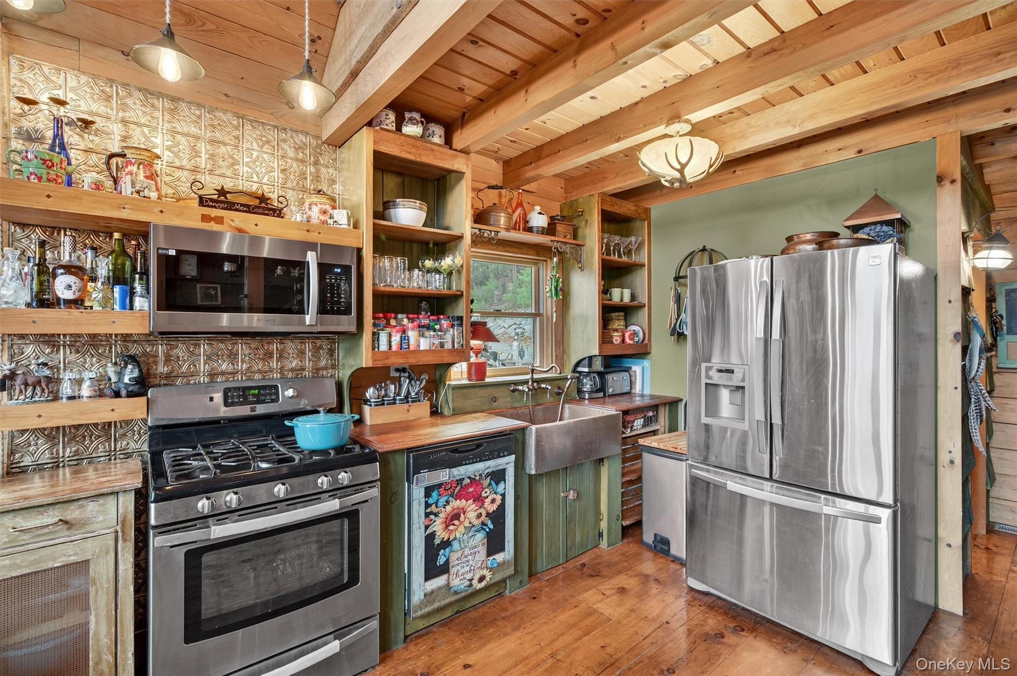 129 Hallock Road Barryville, NY 12719 - Photo 7 of 18 a kitchen with stainless steel appliances granite countertop a stove a refrigerator and a microwave